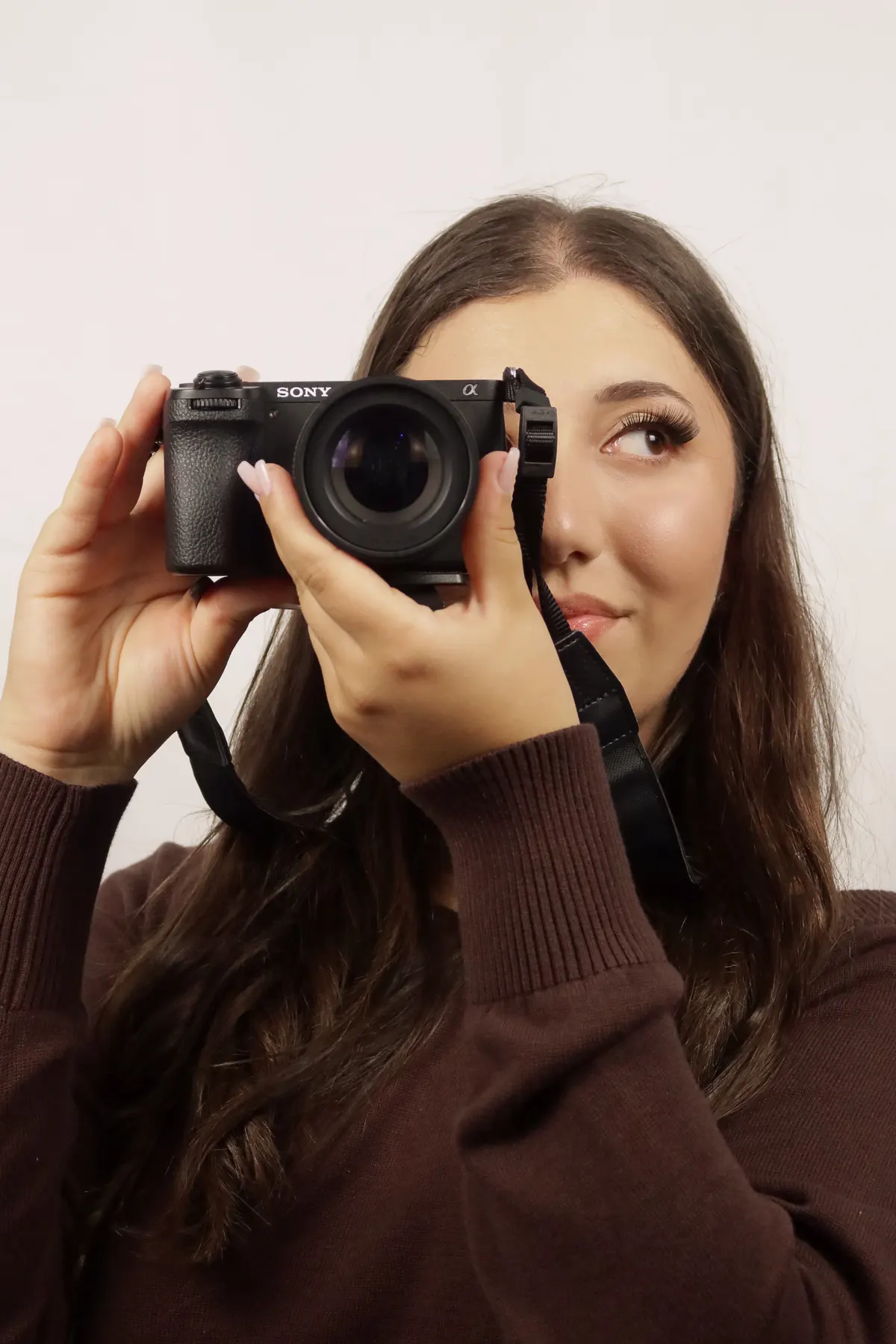 Jess Succar, JS Imagery photographer, holding her camera